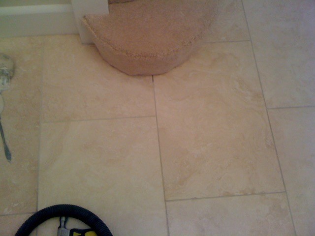 A Repaired & Polished Travertine Floor Tile