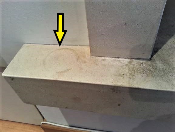 A Candle stain on a Limestone Fireplace