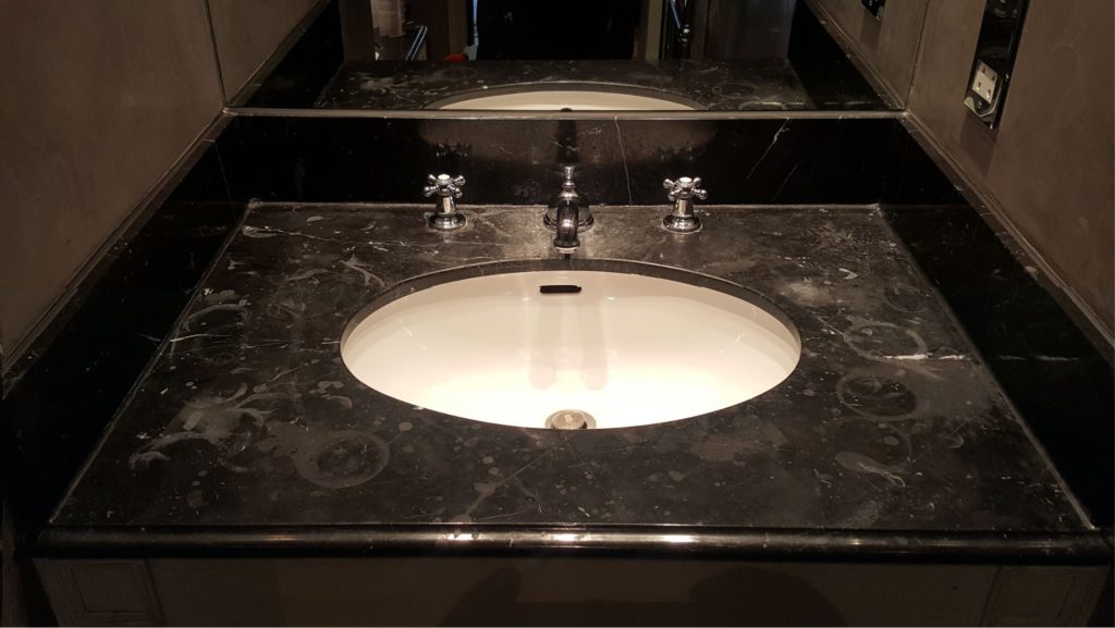 A etched marble vanity top, before being repolished with HG Natural Stone Polish 
