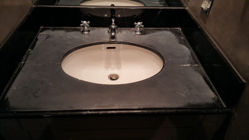 Marble Vanity top sanded back to remove etch marks with a 400 grit sanding disk.