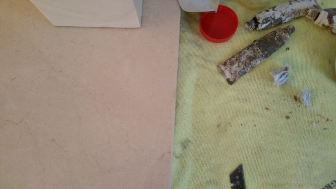 Carpet around marble hearth protected during repair works